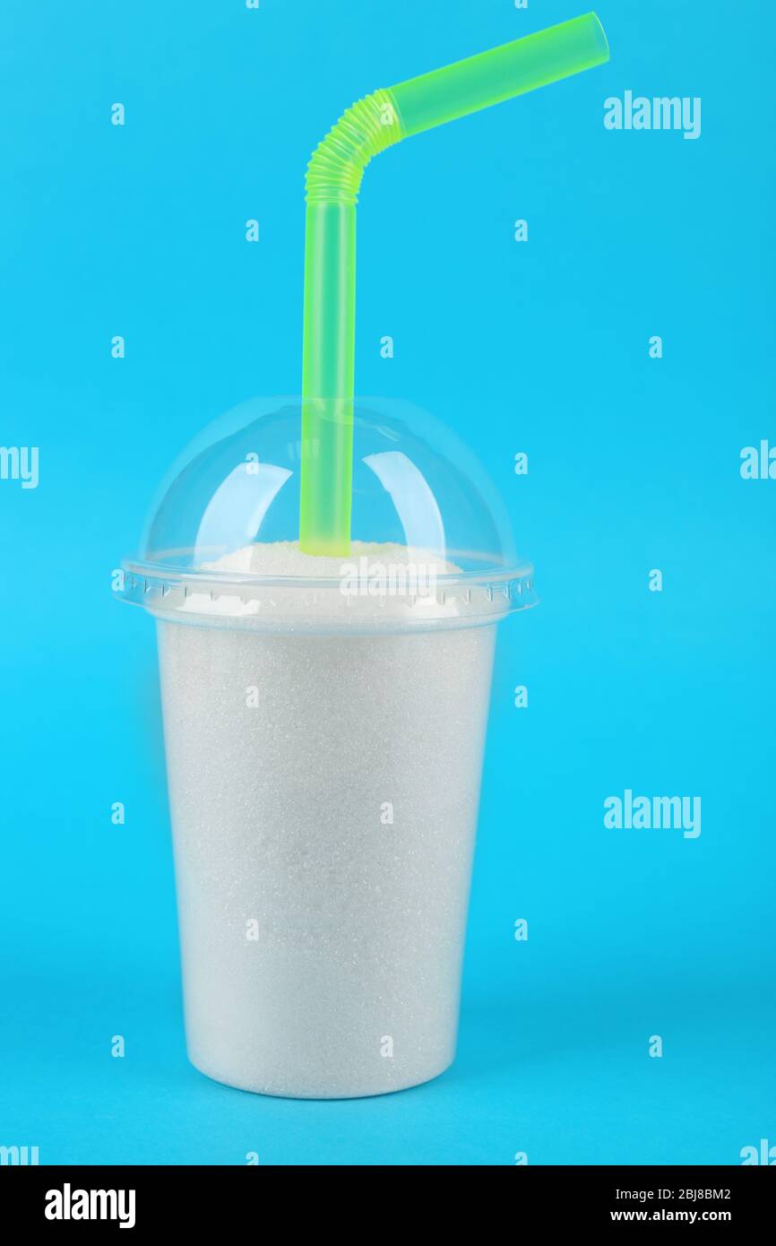 https://c8.alamy.com/comp/2BJ8BM2/plastic-smoothie-cup-with-granulated-sugar-and-cocktail-tube-on-blue-background-2BJ8BM2.jpg