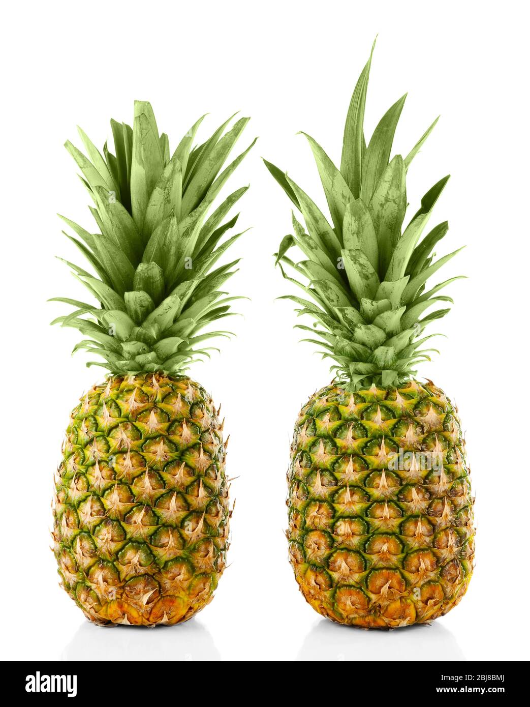 Two ripe fresh pineapples, isolated on white Stock Photo