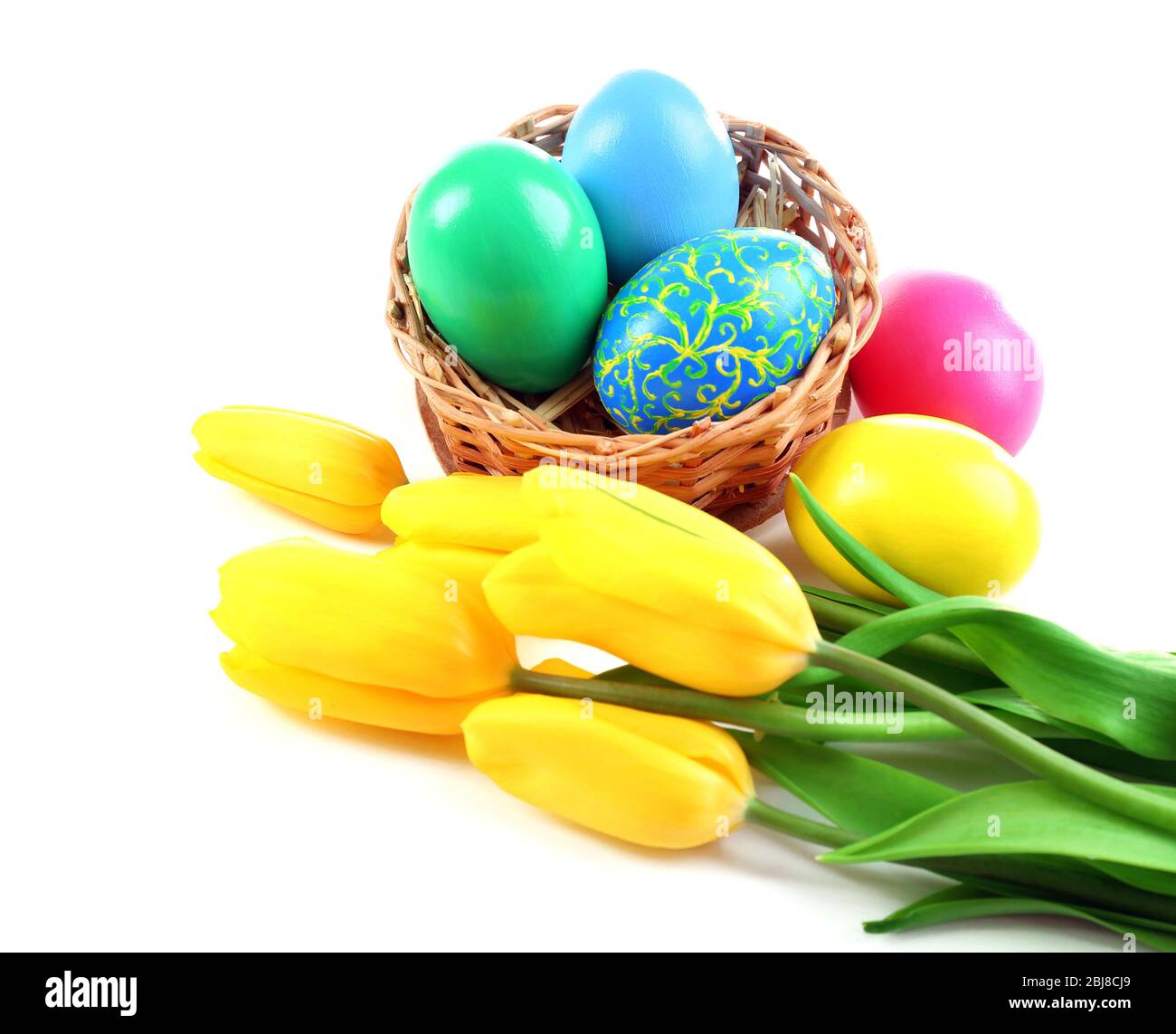 Multicoloured Easter eggs and tulips isolated on white Stock Photo - Alamy