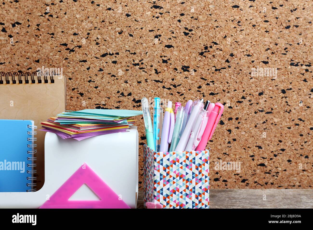 Stationery on cork desk background Stock Photo