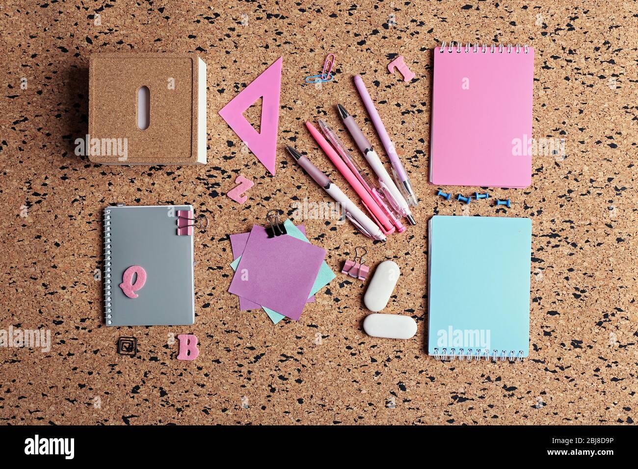 Stationery on cork desk background Stock Photo