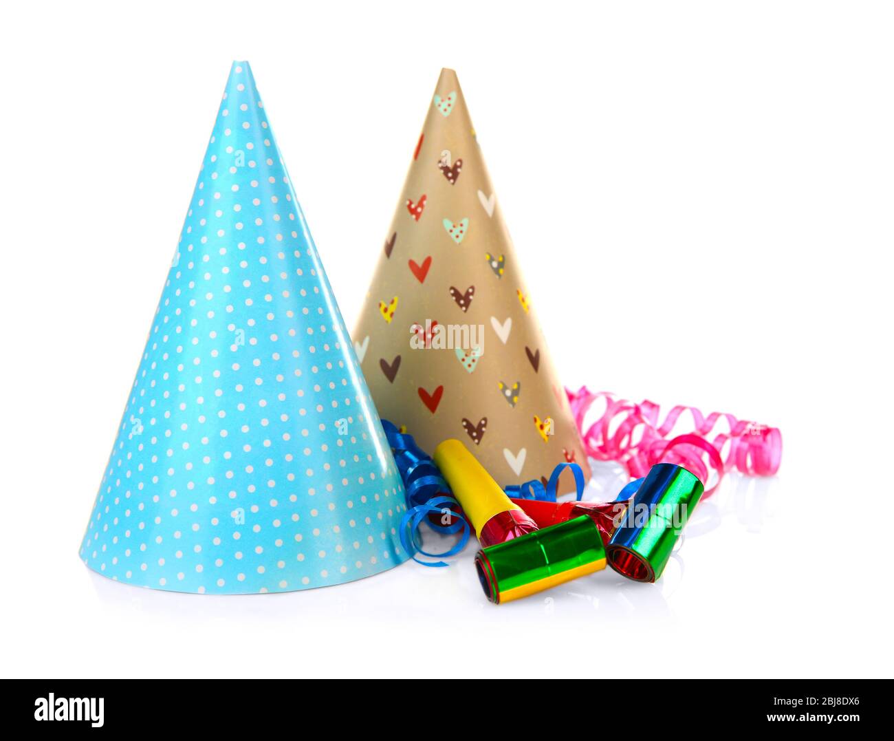 Party hats with blowers, isolated on white Stock Photo - Alamy