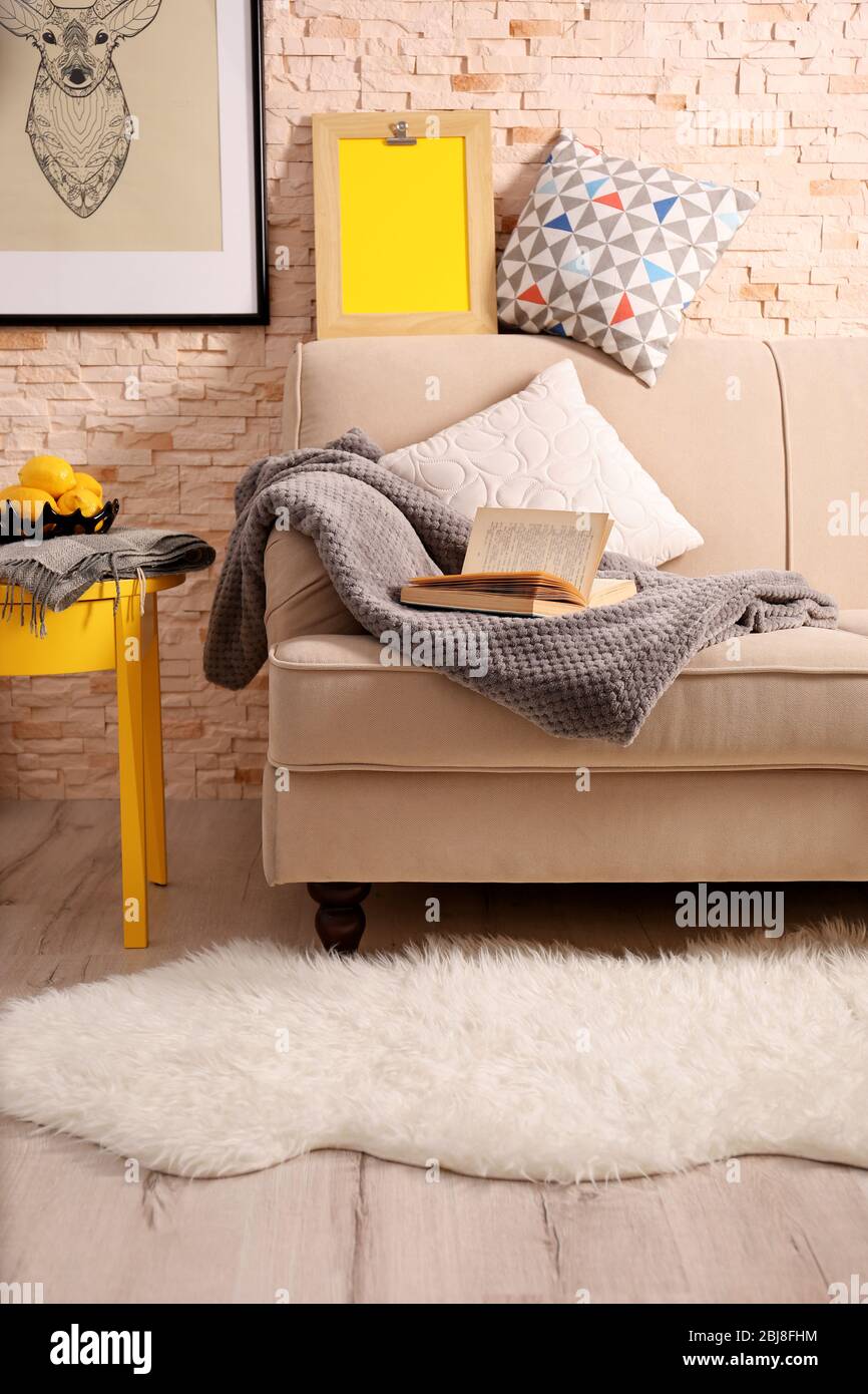 Beige sofa in modern room interior Stock Photo - Alamy