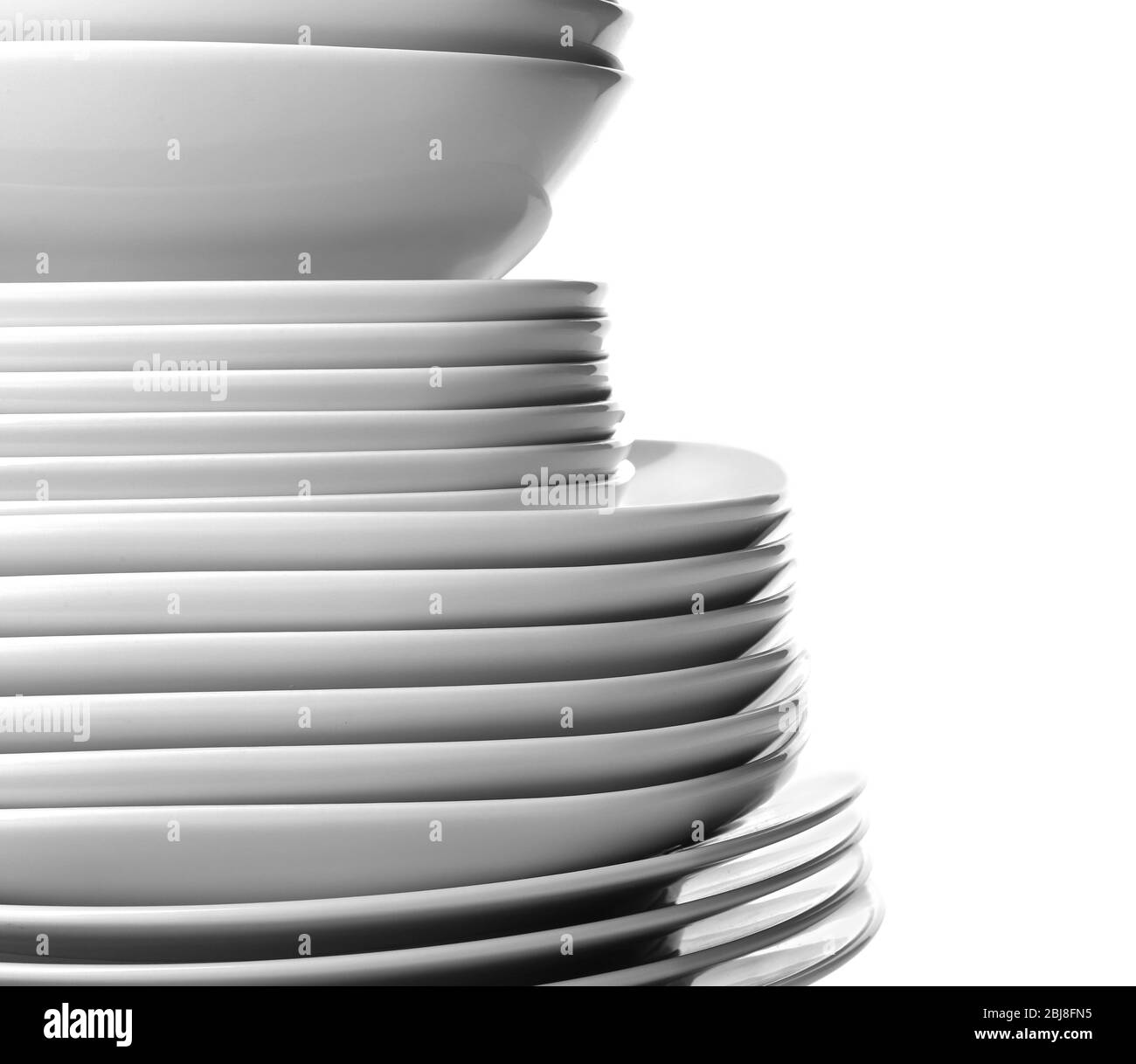 Stack of different ceramic plates, isolated on white Stock Photo Alamy