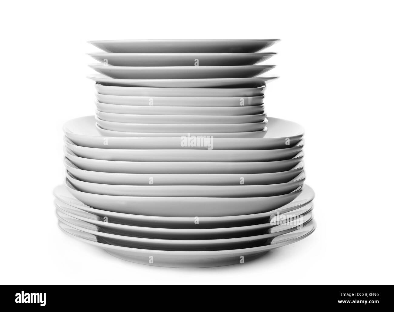 Stack of different ceramic plates, isolated on white Stock Photo Alamy