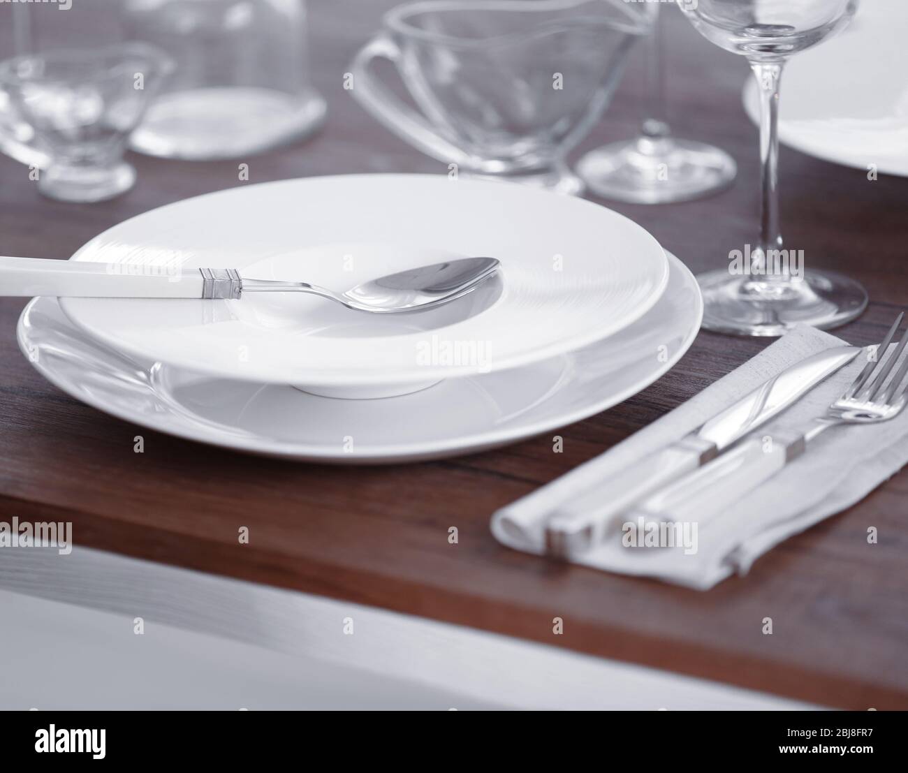 Table setting with plates and cutlery Stock Photo