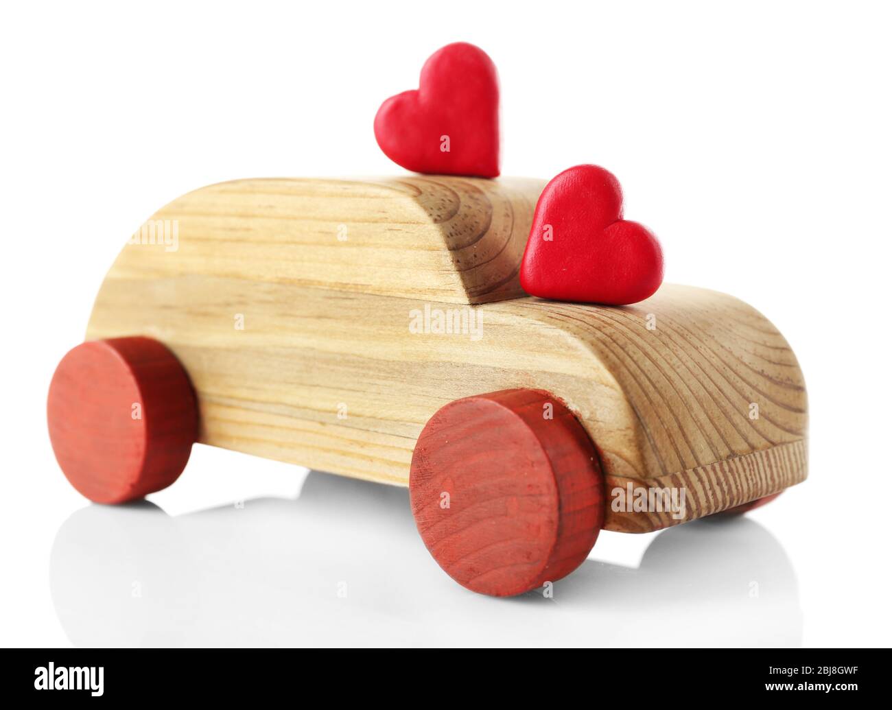 Wooden car with little red hearts isolated on white Stock Photo - Alamy