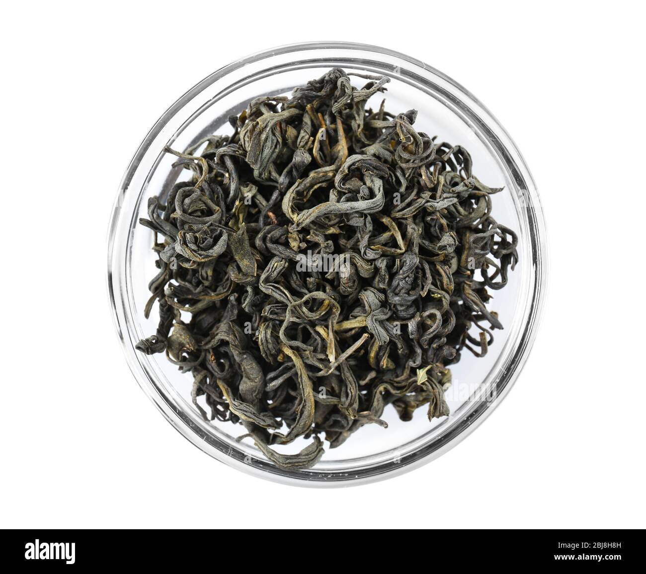 Dry tea in saucer isolated on white Stock Photo Alamy