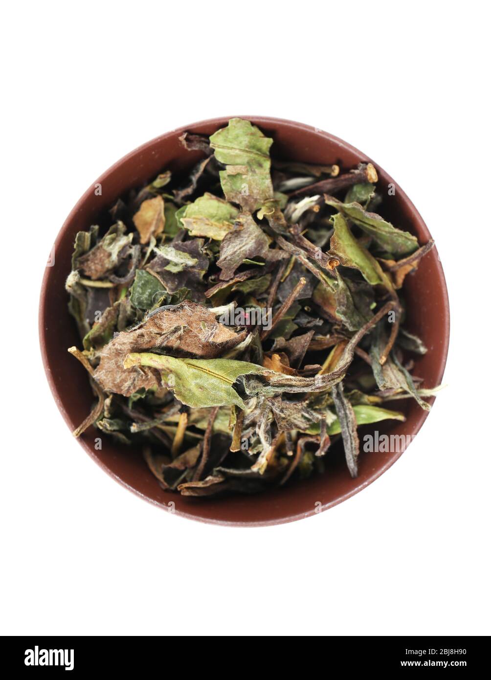 Dry tea in saucer isolated on white Stock Photo Alamy
