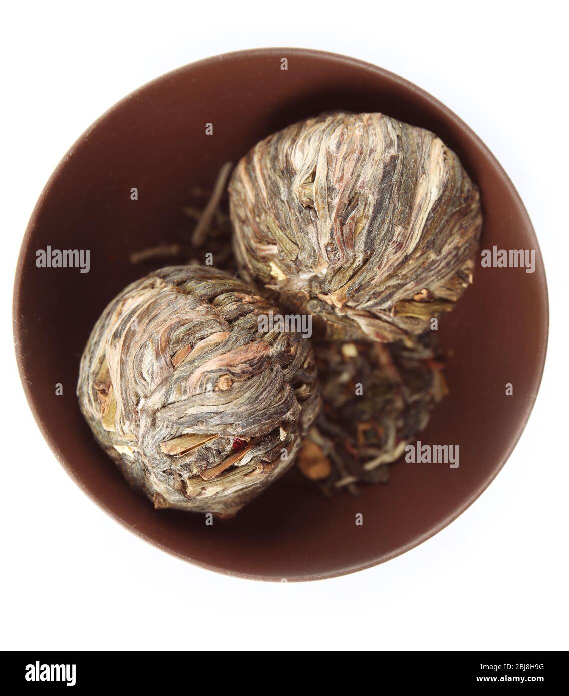 Dry tea in saucer isolated on white Stock Photo Alamy