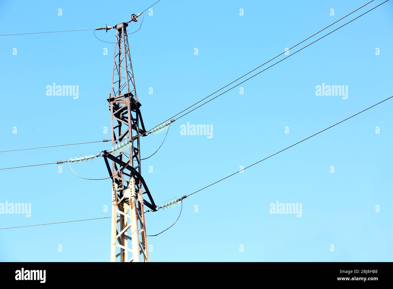 Electric pole over blue sky background Stock Photo - Alamy