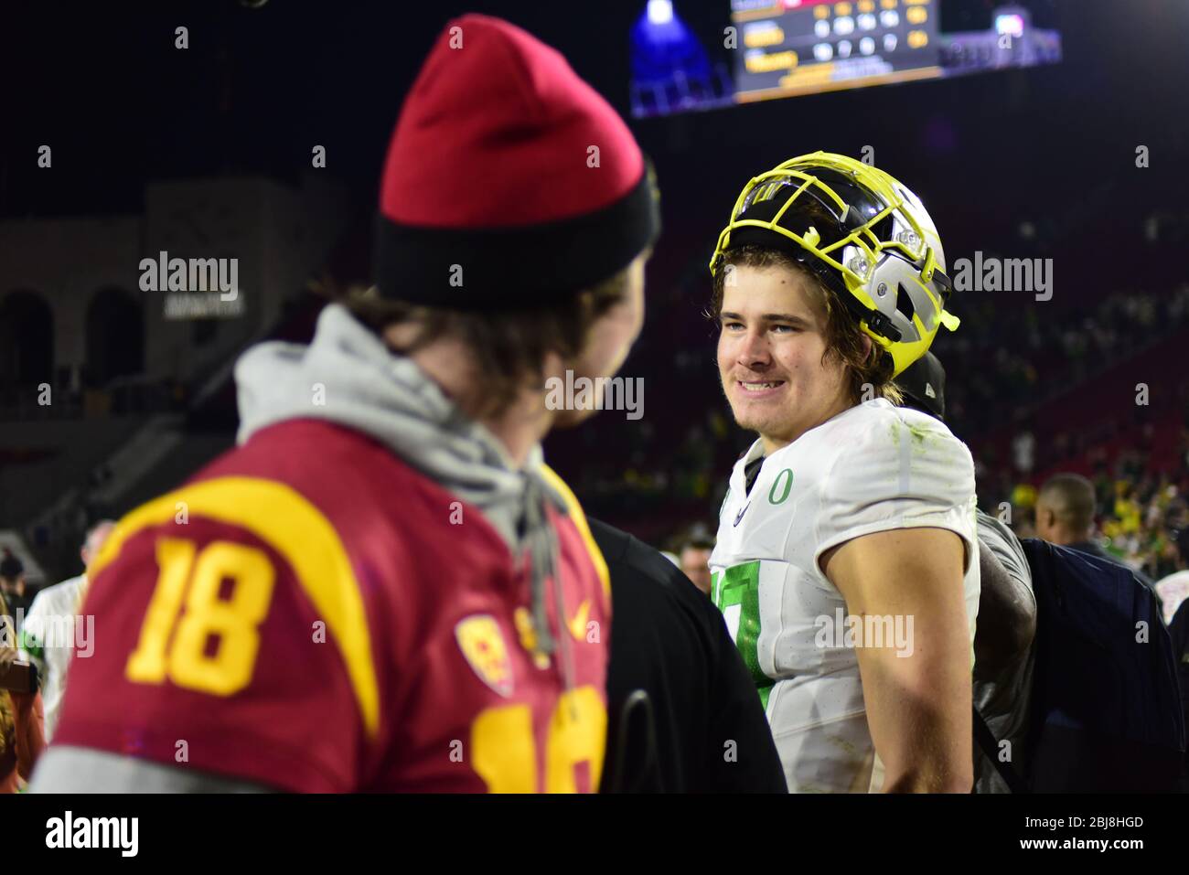 Hollywood, CA. 24th July, 2019. Oregon Ducks quarterback Justin Herbert  poses for a photo in front of the Rose Bowl and National Championship  trophies at the Pac-12 football media day on Wednesday