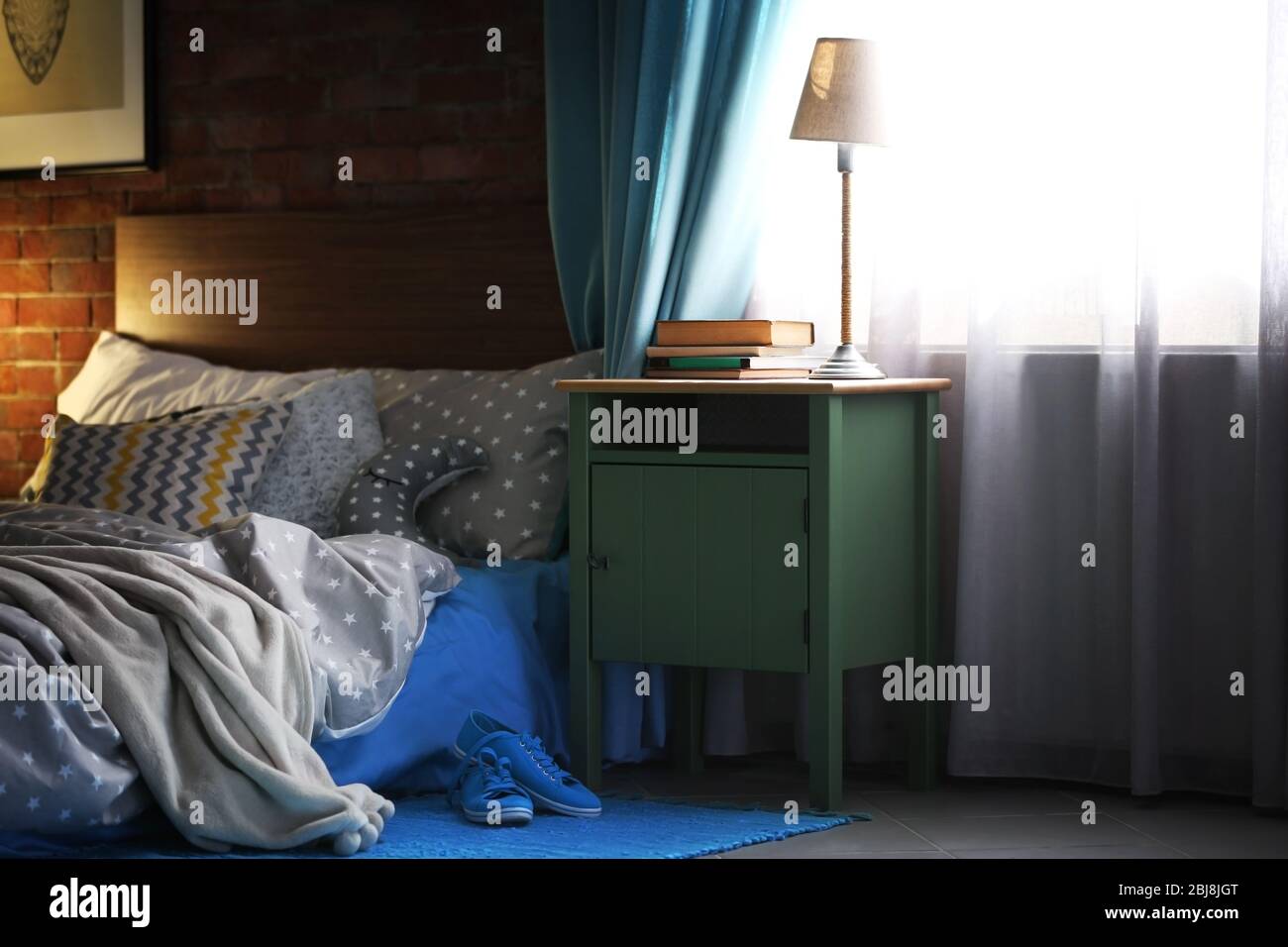 Green bedside table in living room Stock Photo Alamy