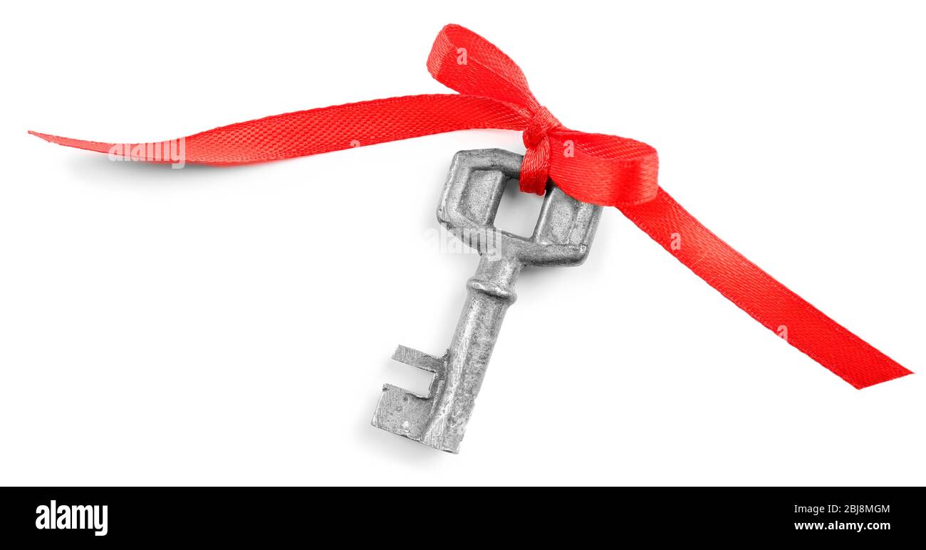 Old key with red bow, isolated on white Stock Photo Alamy