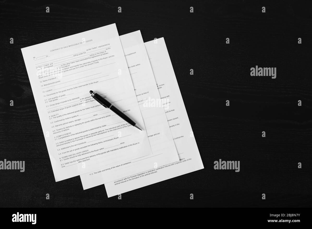 Documents and pen on wooden table, top view Stock Photo - Alamy