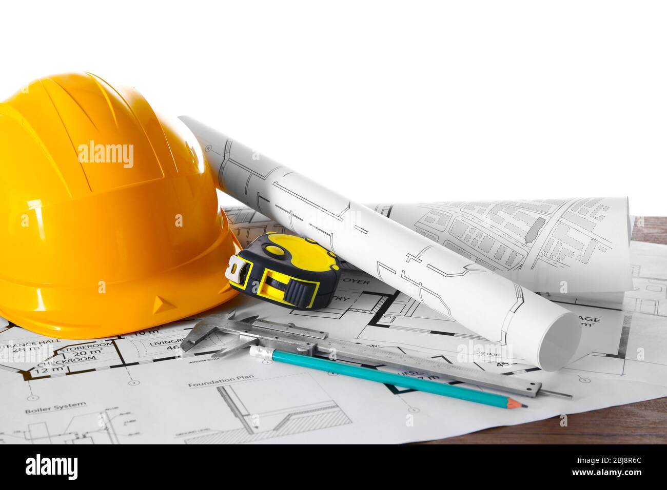 Construction blueprints with tools and helmet on white background Stock ...