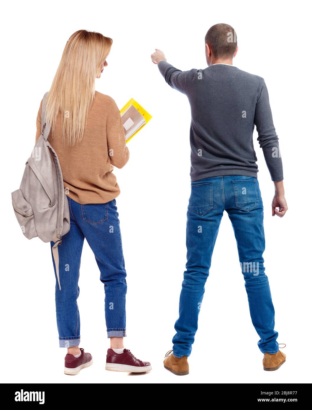 Back view of couple in sweater pointing. Rear view people collection ...
