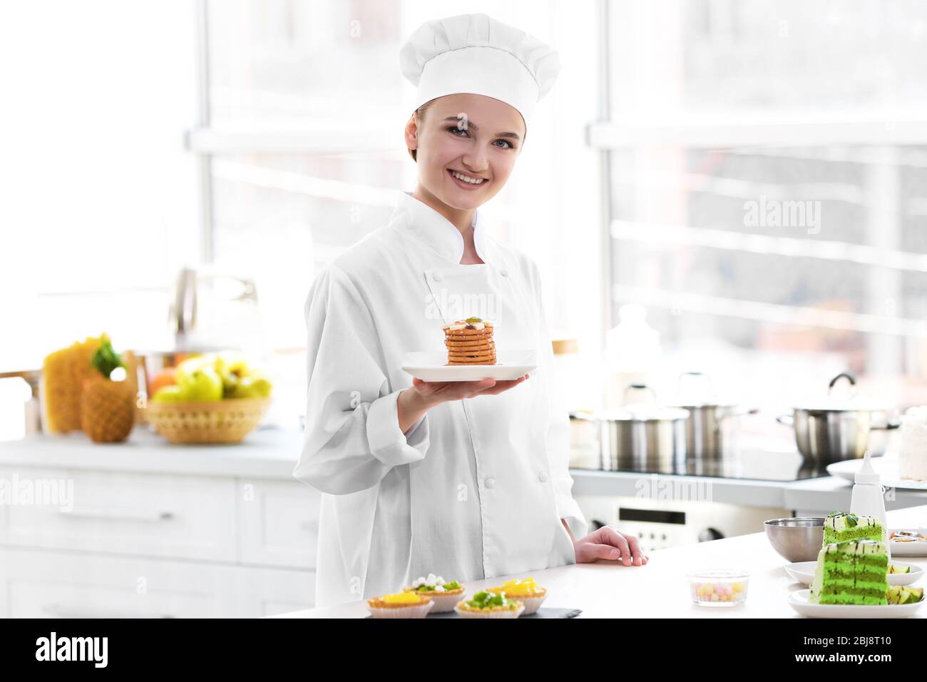 Female chef working at kitchen Stock Photo Alamy