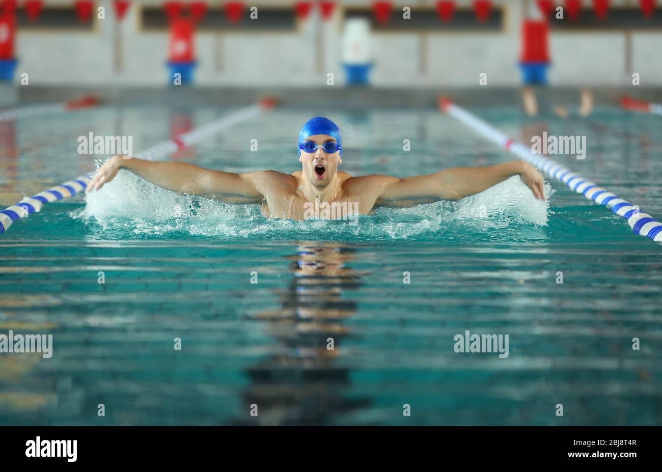 Sporty man in swimming cap hi-res stock photography and images - Alamy