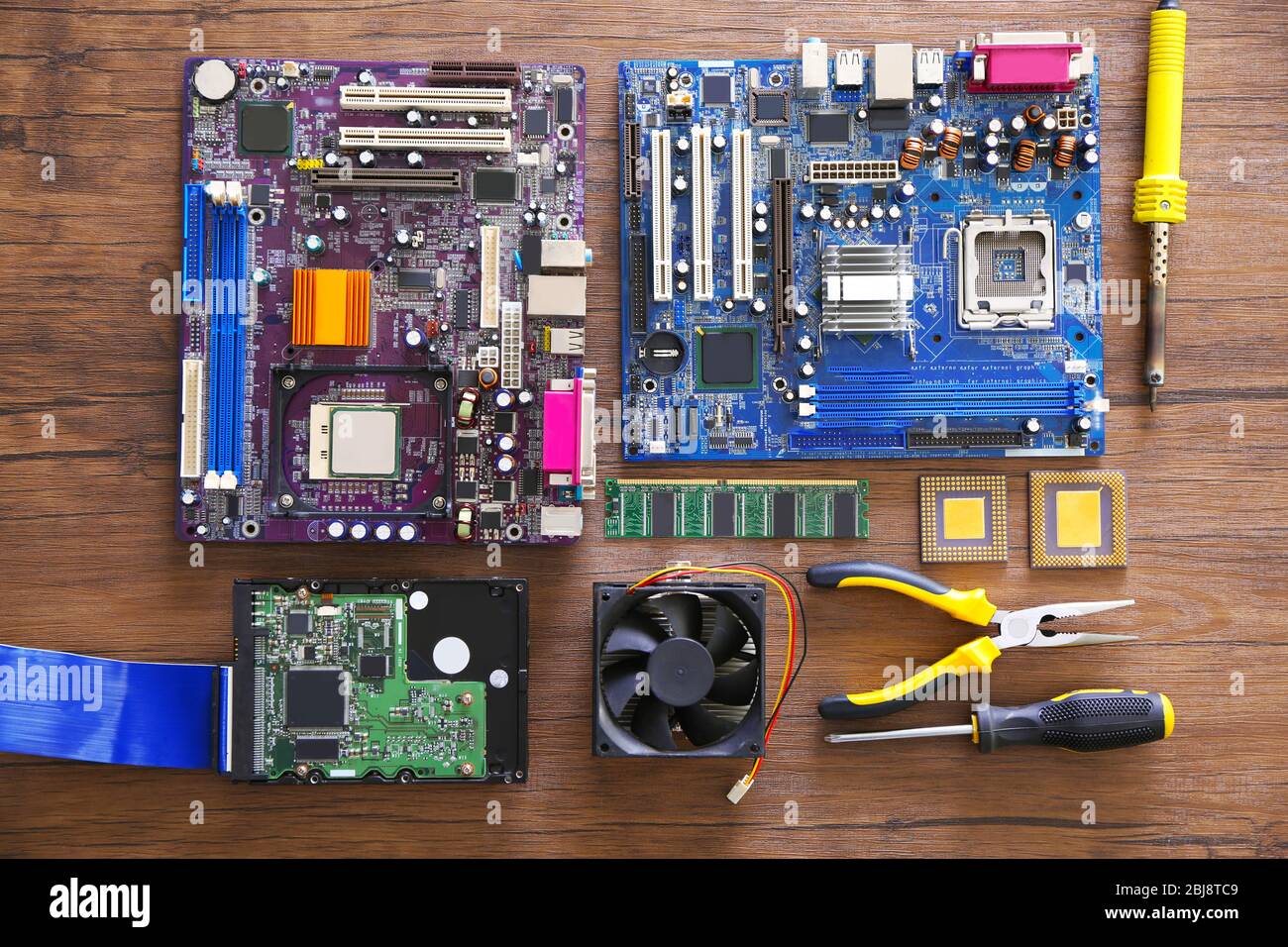 Electronic circuits on wooden table, top view Stock Photo