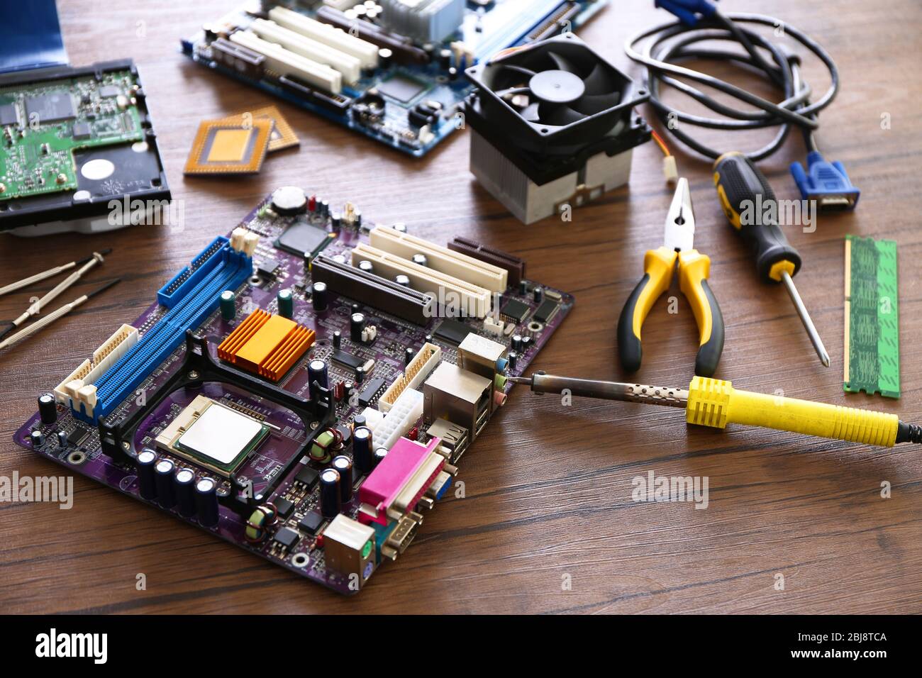 Electronic circuits on wooden background Stock Photo