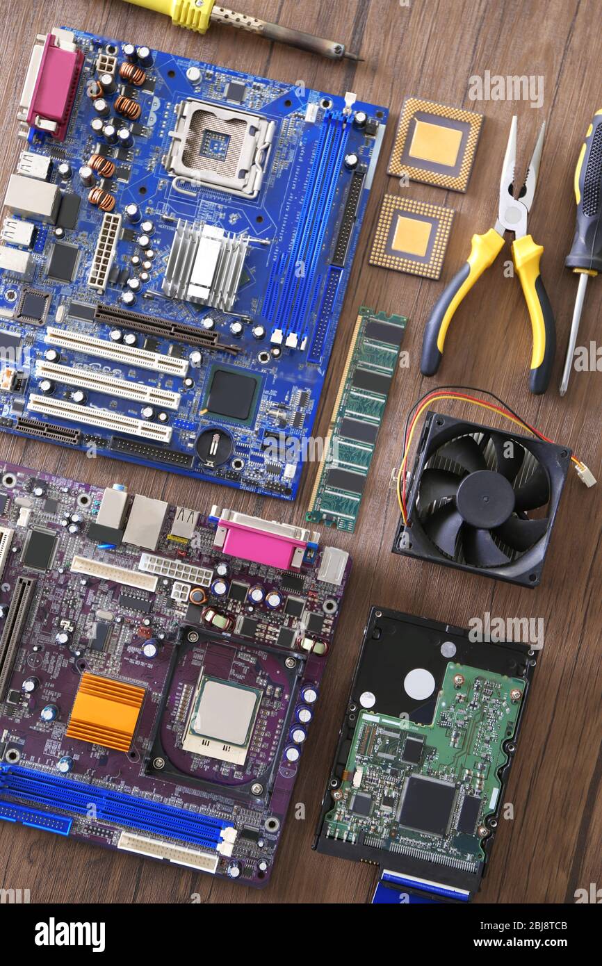 Electronic circuits on wooden table, top view Stock Photo