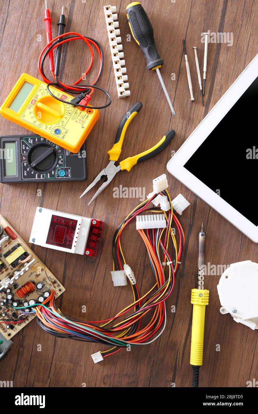 Different electrical tools on wooden table, top view Stock Photo