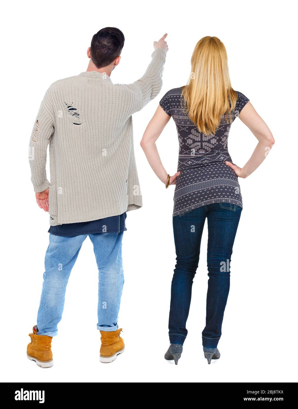 Back view of couple in sweater pointing. Rear view people collection ...