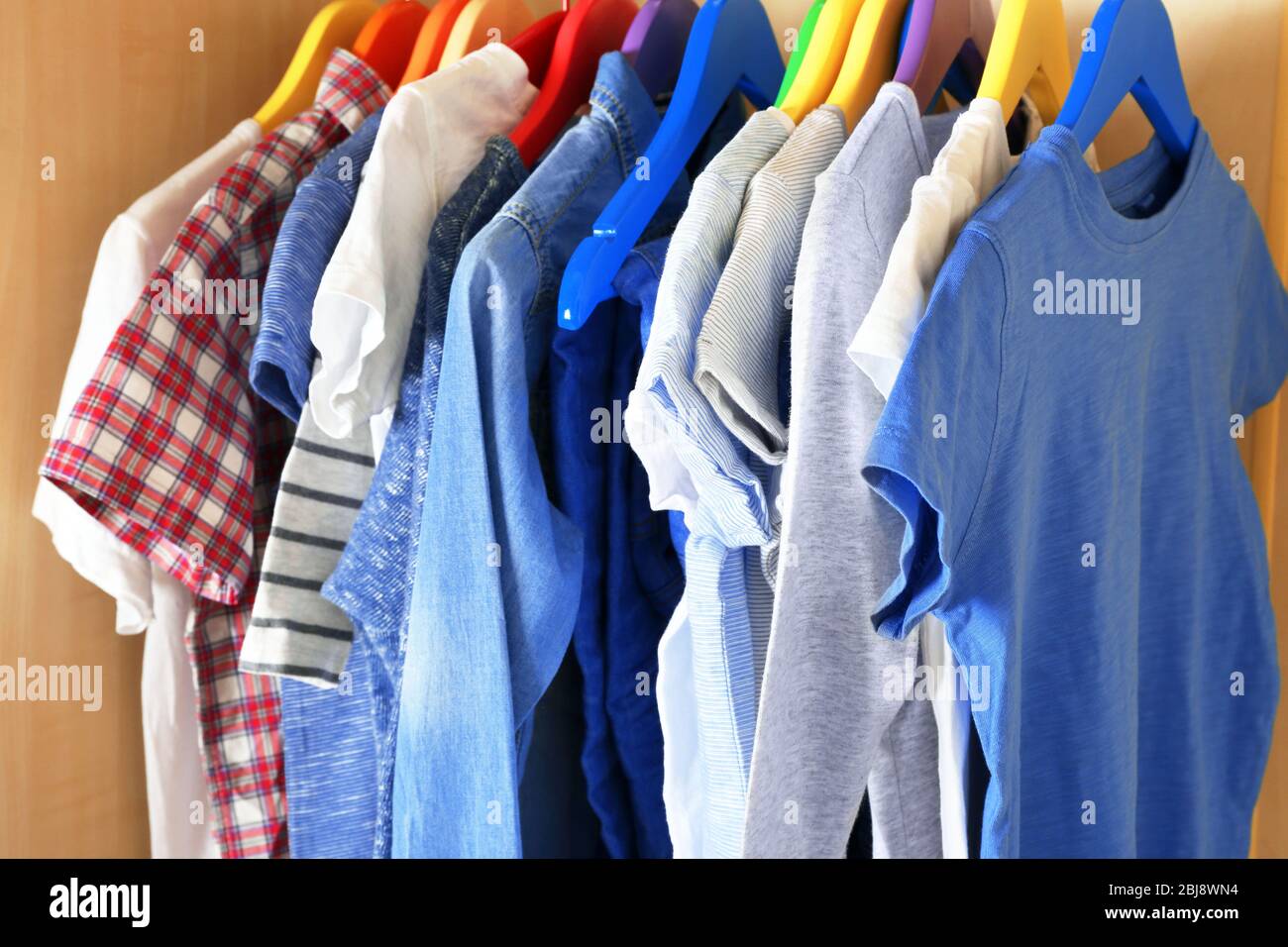 Boy clothes on hangers, closeup Stock Photo