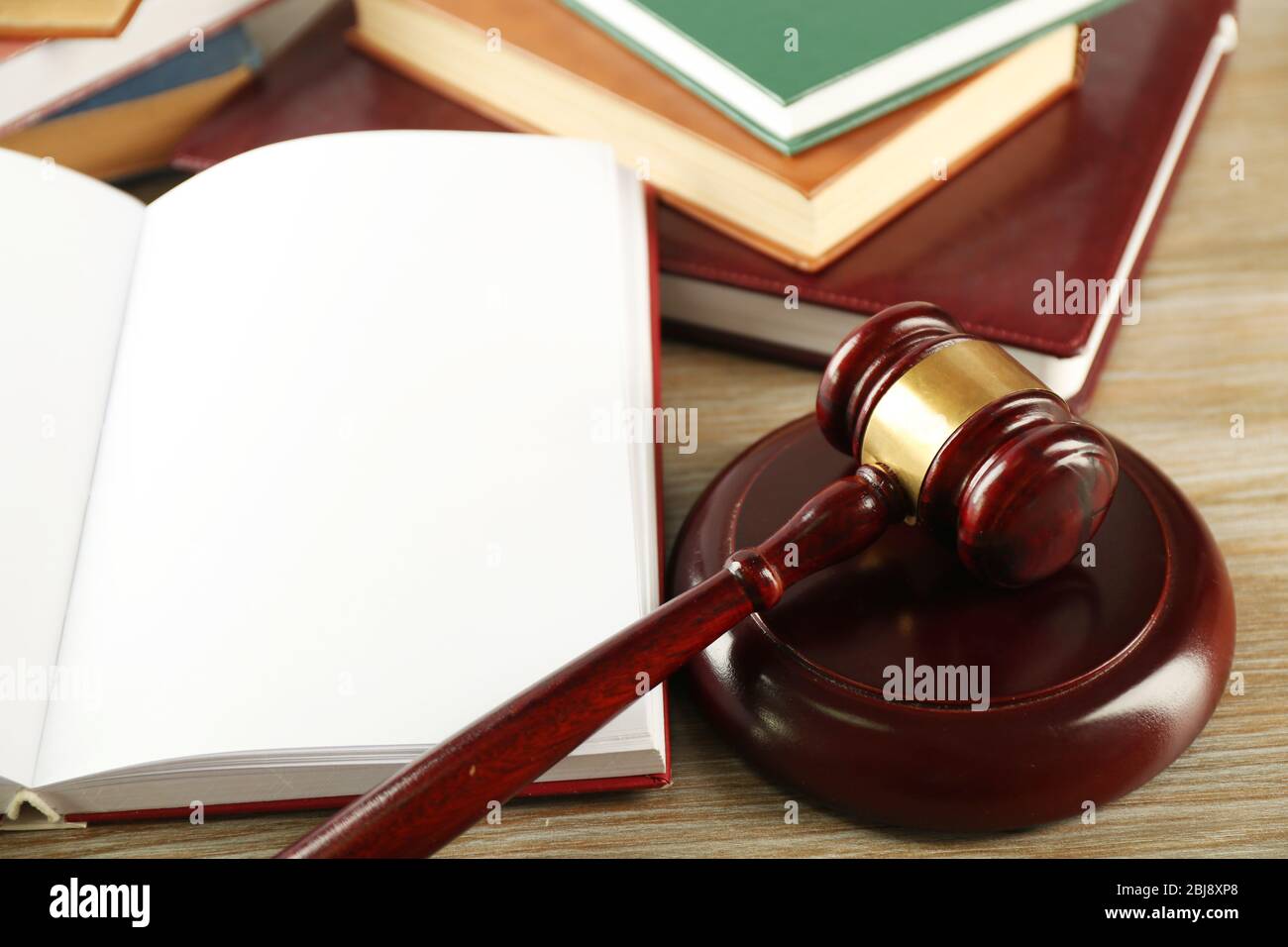Wooden gavel and open book on wooden background Stock Photo - Alamy