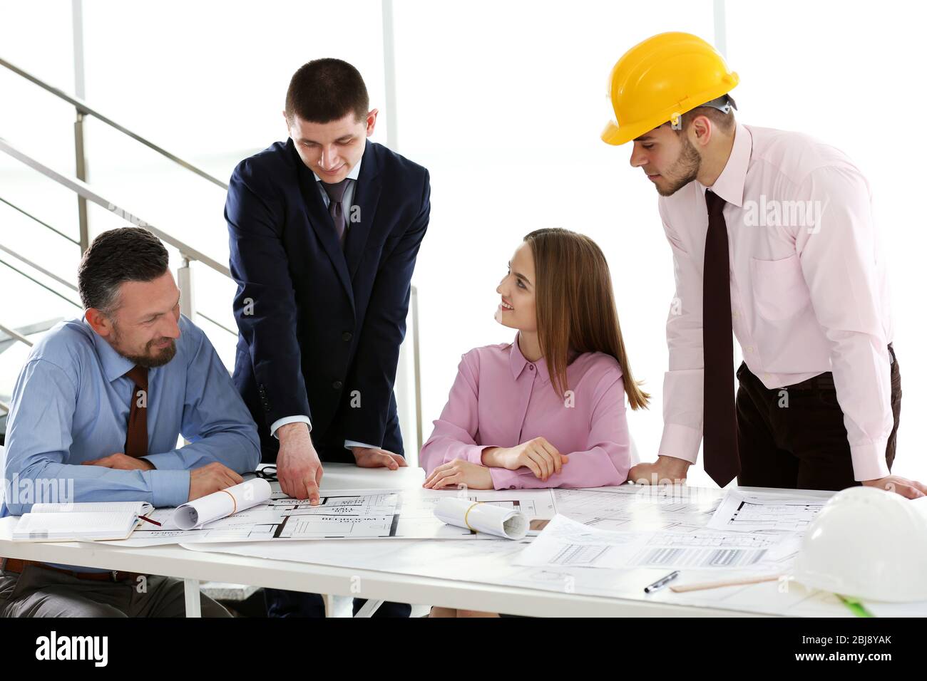 Team engineers analyzing blueprints hi-res stock photography and images ...