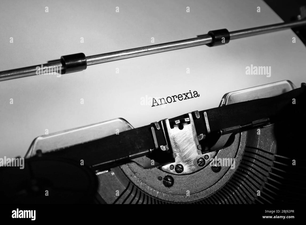 Old typewriter and inserted sheet of paper with medical report on anorexia Stock Photo