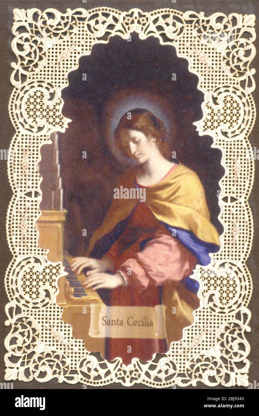 St Cecilia prayer card showing the patron saint of music playing a pipe organ circa 1890s Stock Photo