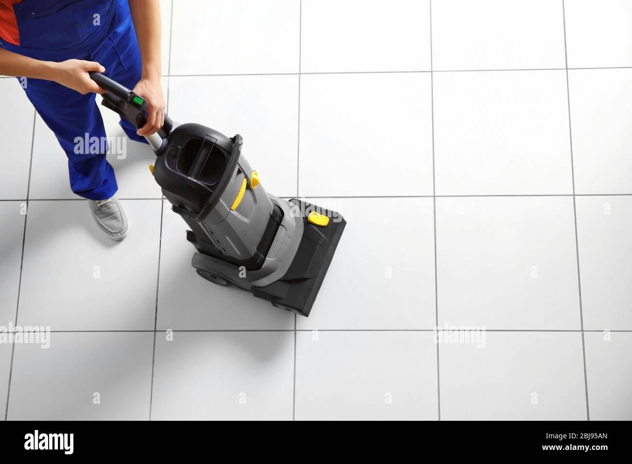 Man vacuuming floor hi-res stock photography and images - Alamy