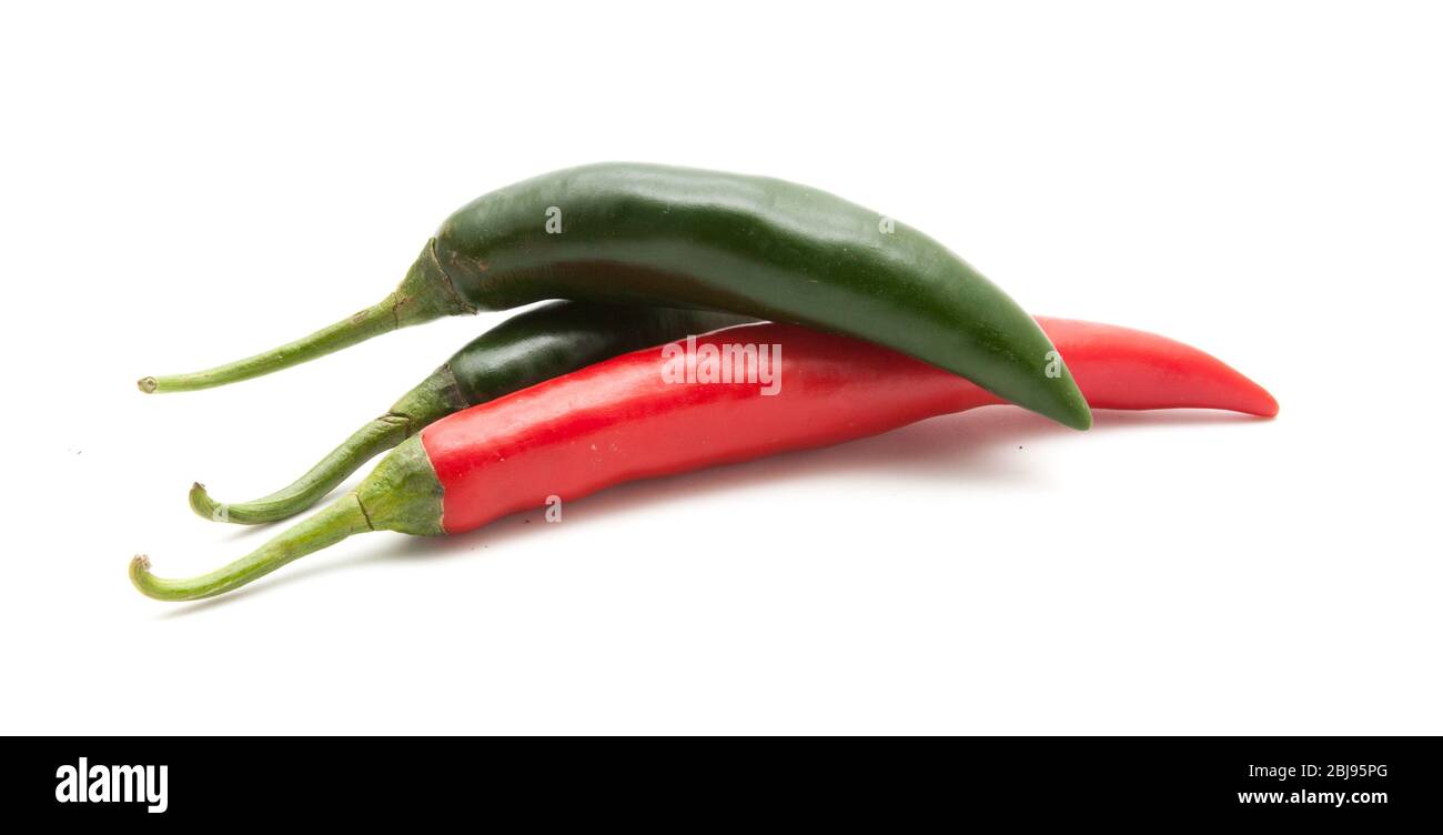 Red and green hot chili peppers isolated on white background closeup ...