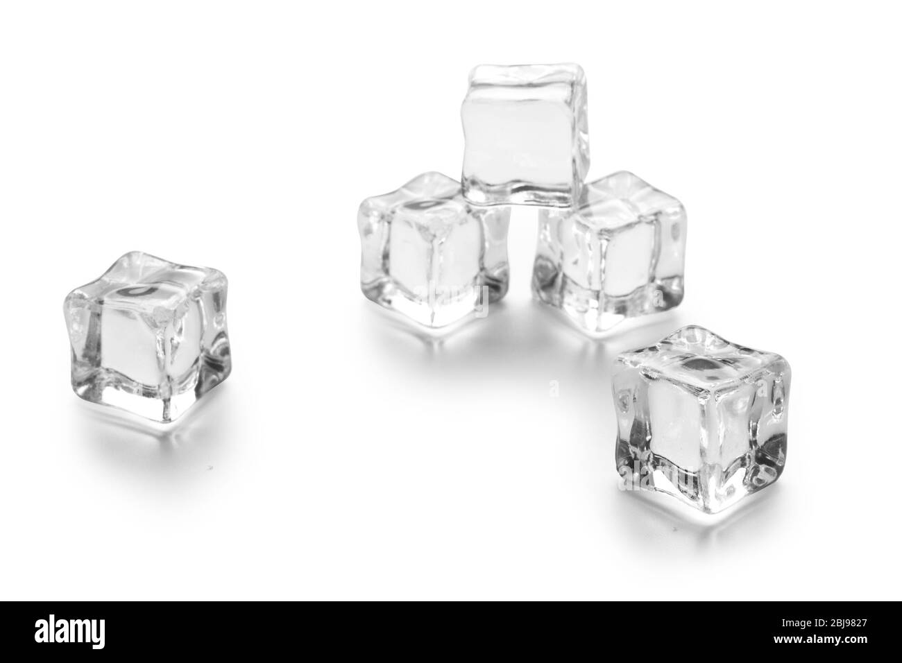 three ice cubes on white background Stock Photo - Alamy