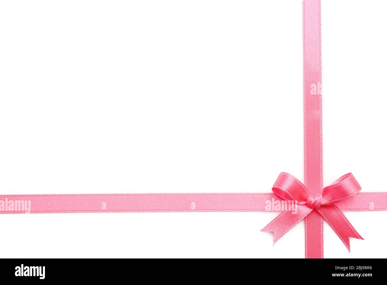 Pink ribbon bow on white background Stock Photo - Alamy
