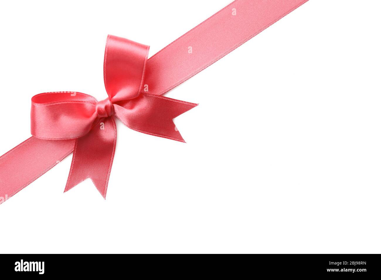Pink ribbon bow on white background Stock Photo - Alamy