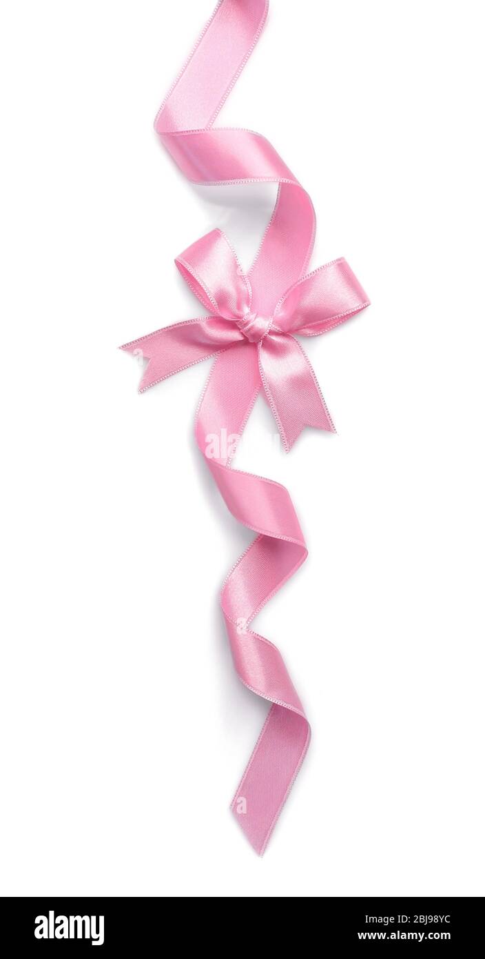 Pink ribbon with bow on white background Stock Photo - Alamy