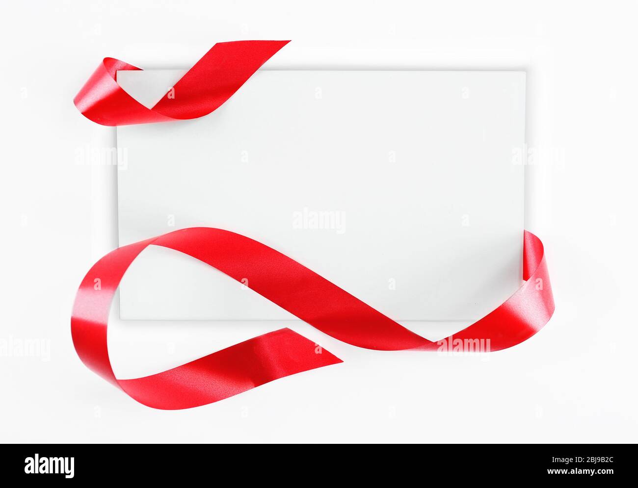 Note Card With Ribbon Note card with red ribbon on white background Stock Photo - Alamy