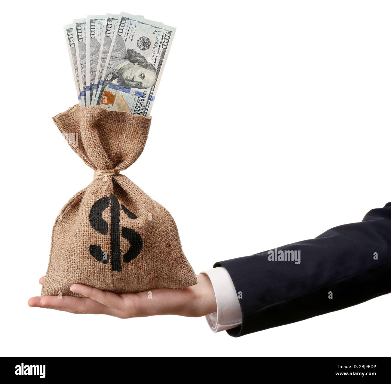 Hand holding money bag isolated on white Stock Photo Alamy