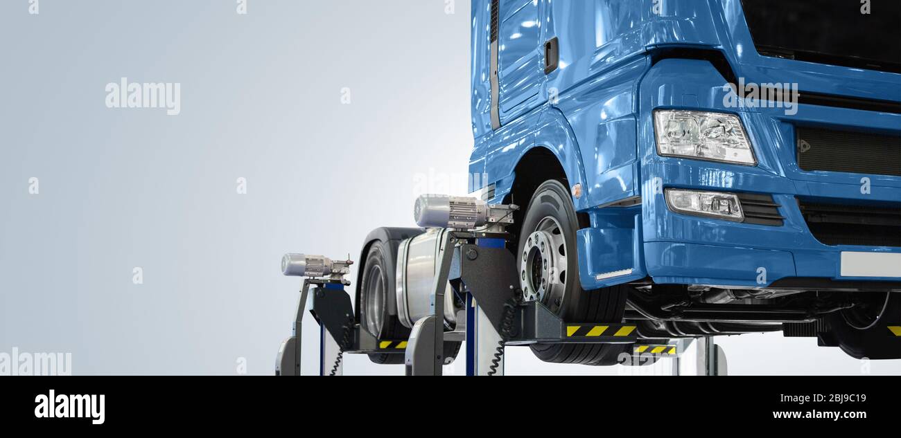 Truck on a lift in a car service Stock Photo - Alamy