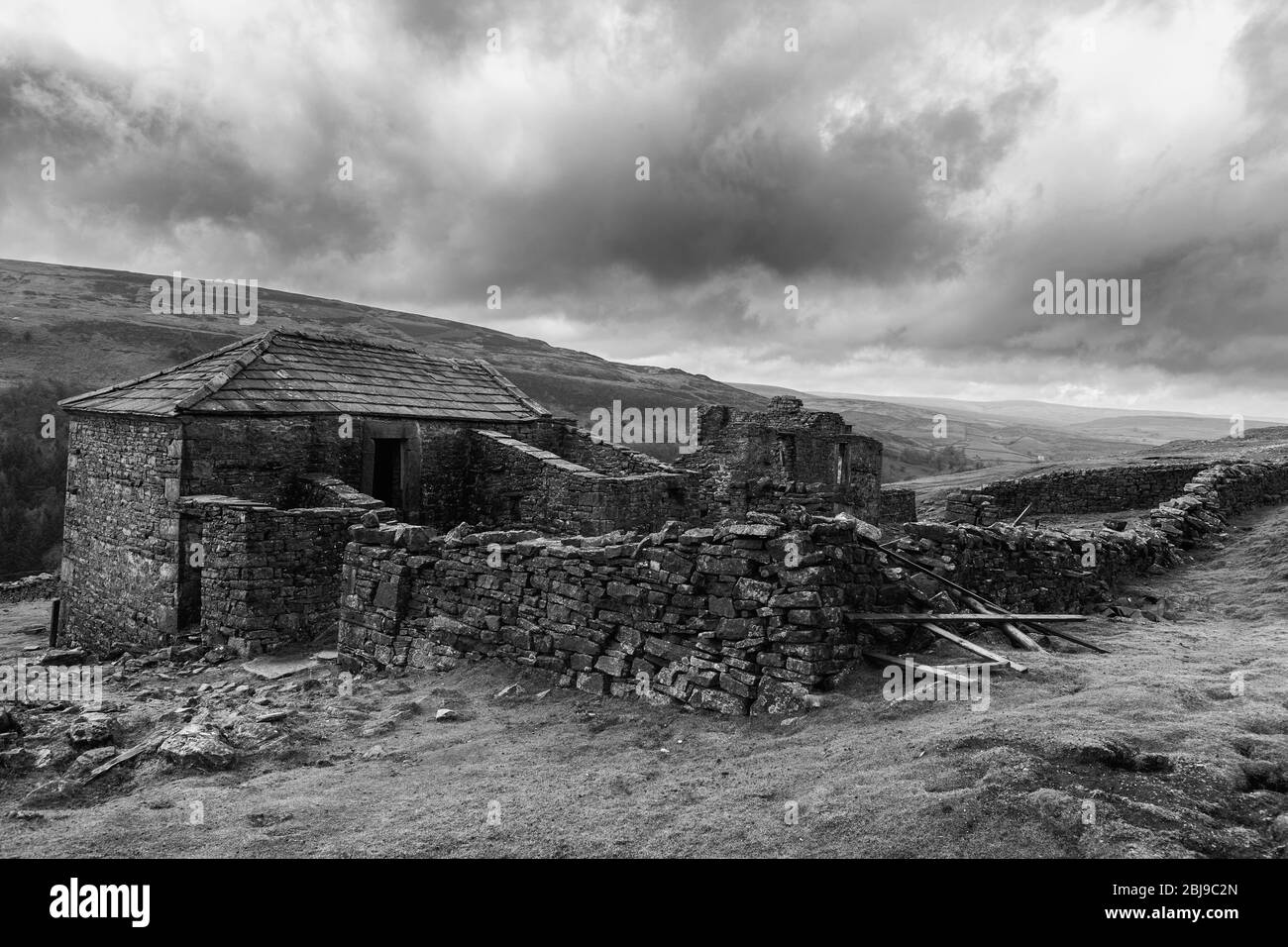 The ruins of Crackpot Halll near Keld, Upper Swaledale, North Yorkshire, England, UK.  Black and white version Stock Photo