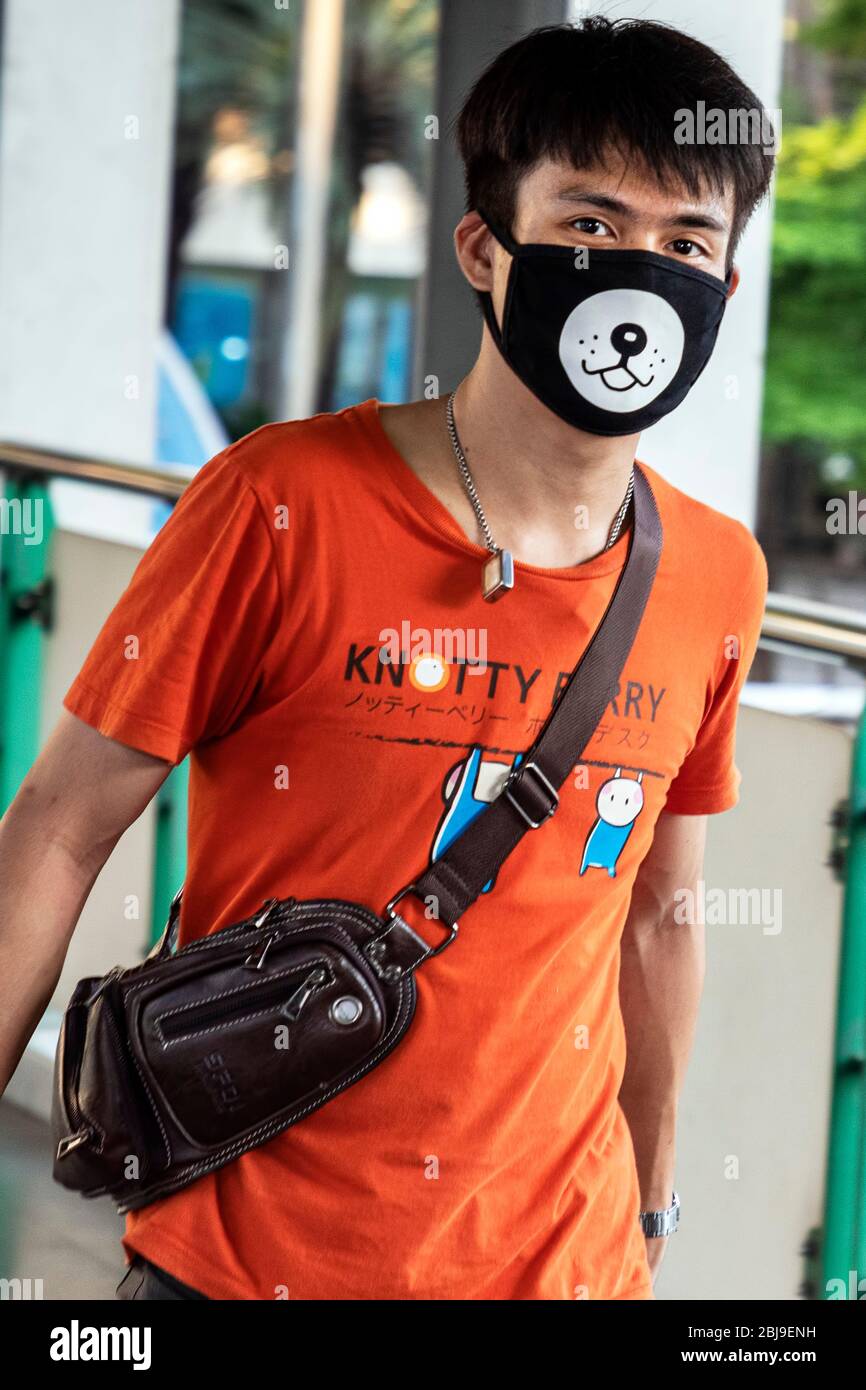Thai boy wearing distinctive face mask during Covid 19 pandemic in