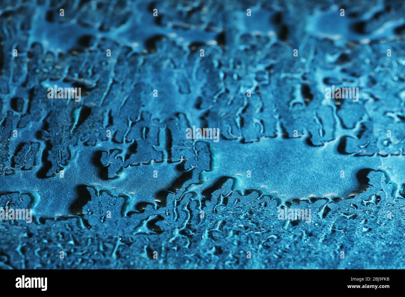 Water drops on blue glass background Stock Photo - Alamy
