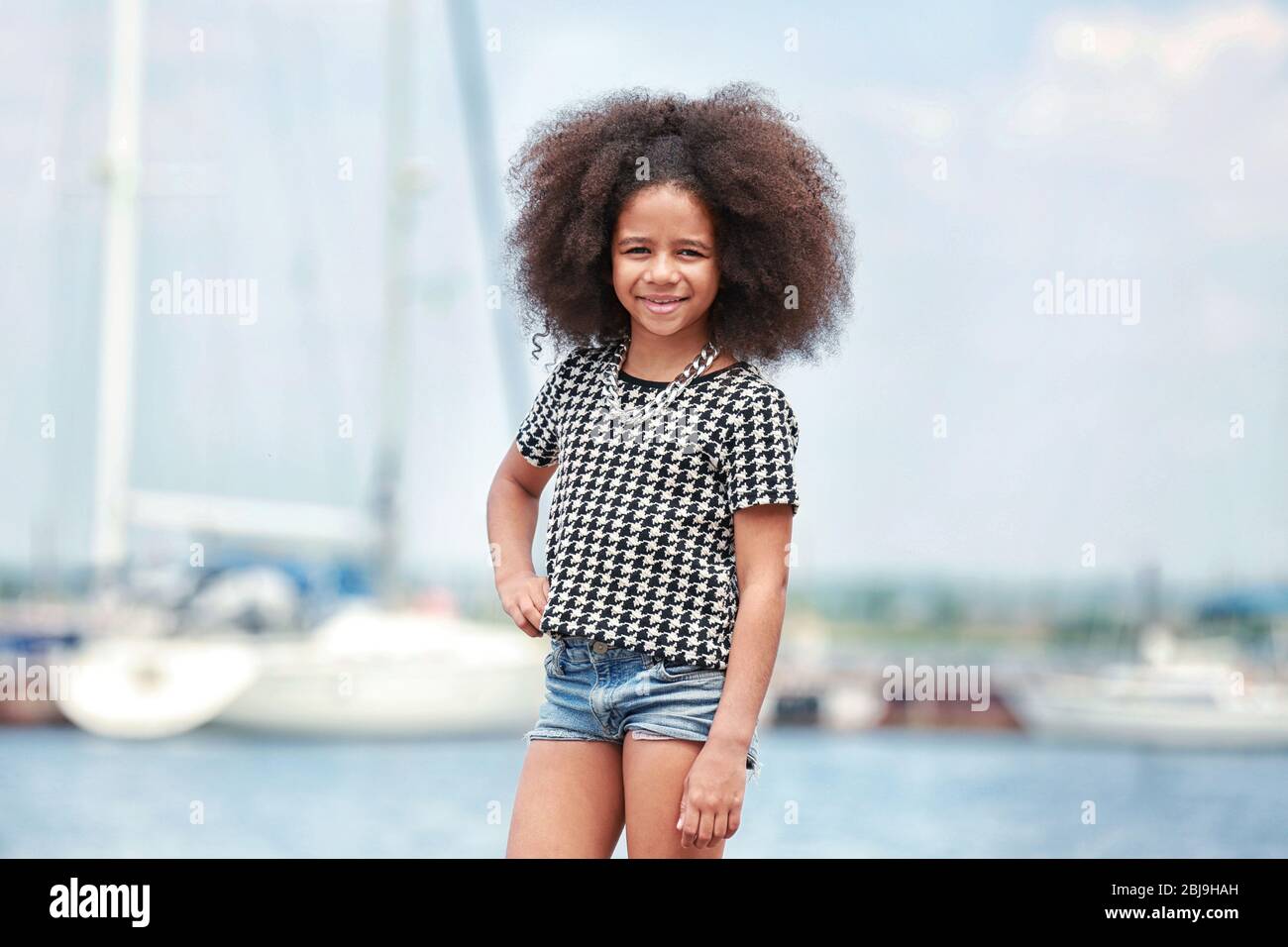 Afro American little girl wearing stylish clothes outdoors. Fashion kid concept Stock Photo Alamy