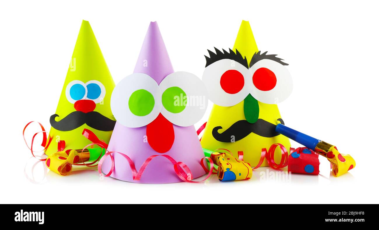 Funny party hats with blowers on a white background Stock Photo - Alamy Funny party hats with blowers on a white background Stock Photo - Alamy