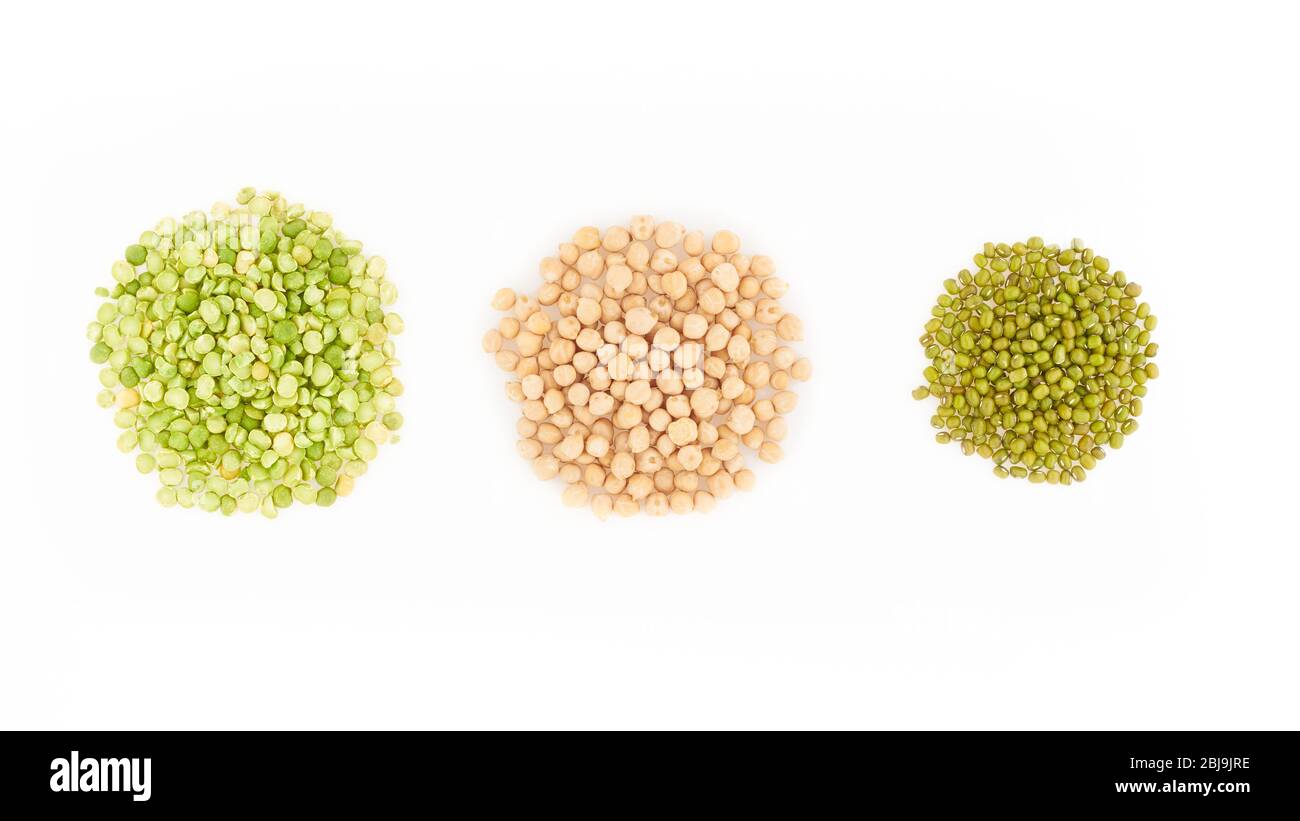 three kinds of raw dried legumes chickpeas, mung bean, green peas