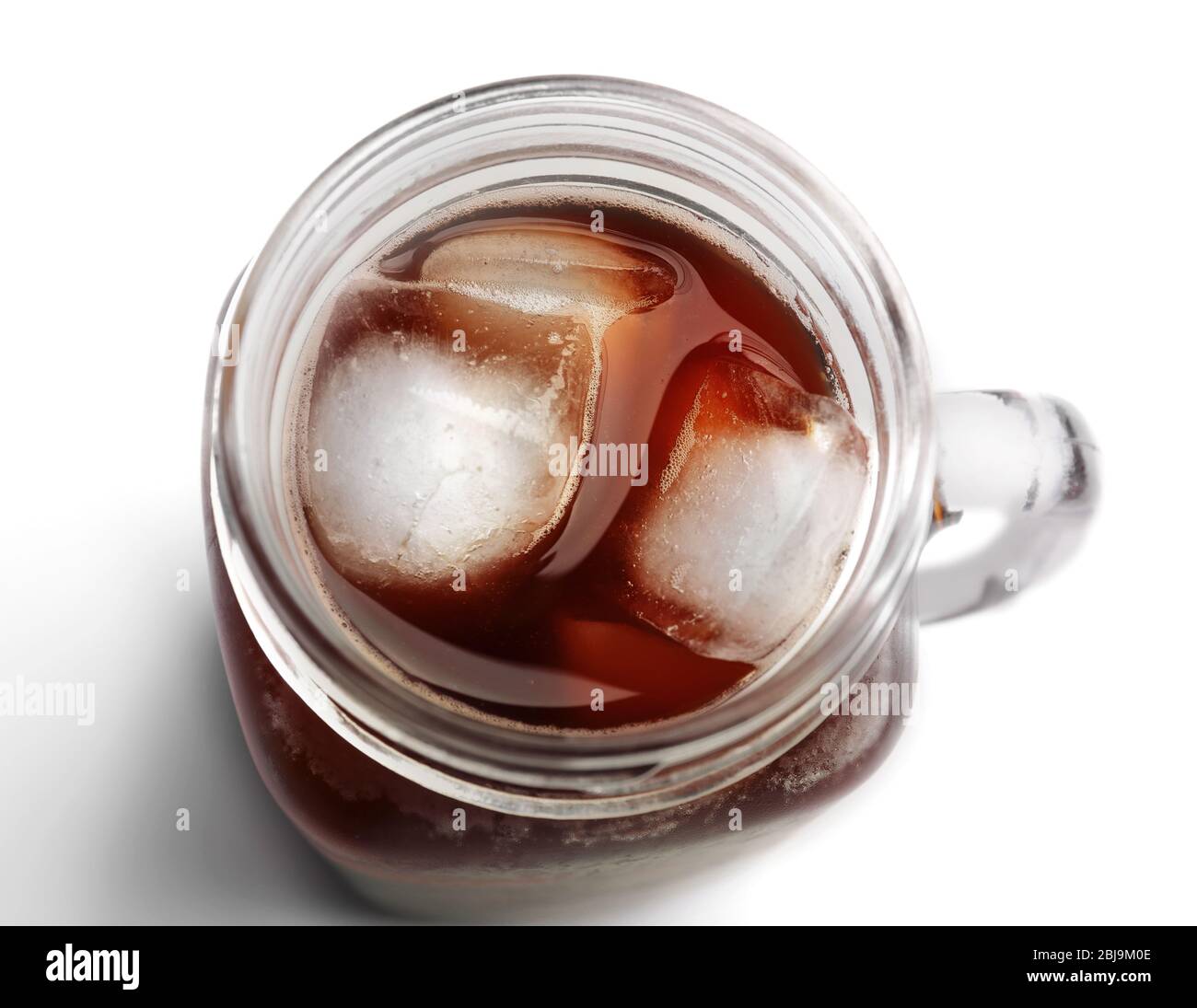 Iced coffee in glass jar on white background Stock Photo Alamy