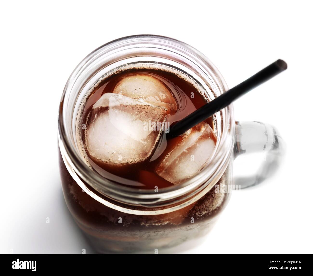Iced coffee in glass jar on white background Stock Photo Alamy